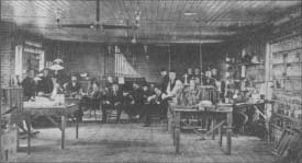 Thomas A. Edison (center, with cap) with workers in his laboratory in Menlo Park, New Jersey. The photo was taken in 1880.